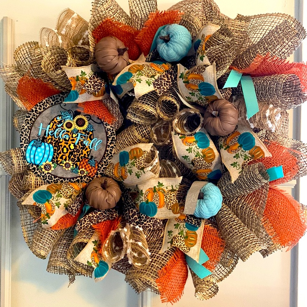 This 14” Hello Fall wreath, new thing with teal and orange animal prints